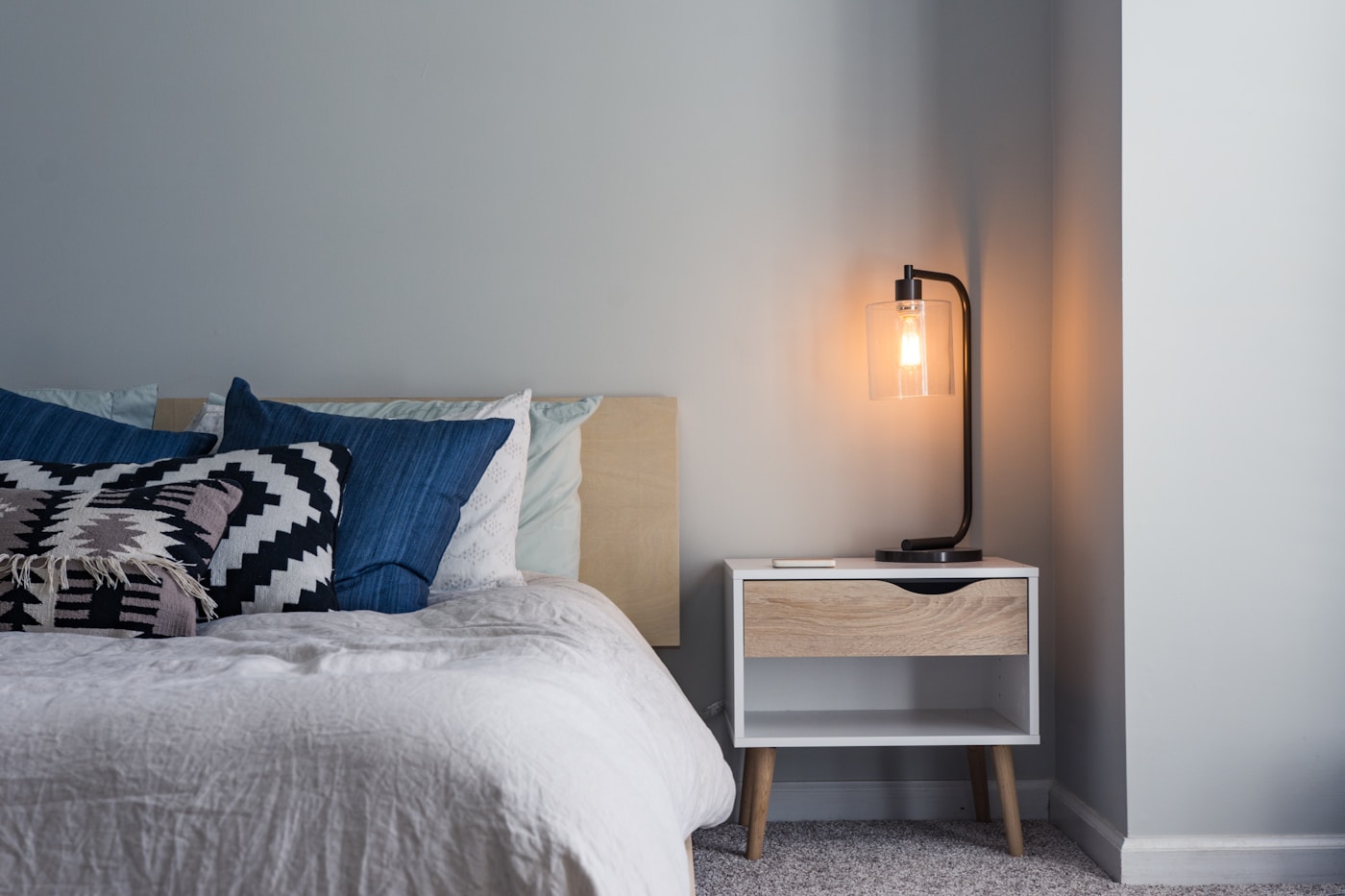 Calm bedroom interior with soft bedding and natural light